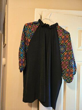 Black L Haptics top, with colorful fabric sleeves, cute for spring-fall